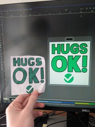 my paper badge vs the new prototype redesign