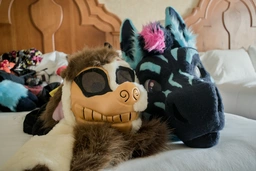 Scrumble's suit head next to Ziggy, Tra$h's suit head