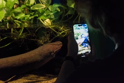 Tra$h taking a photo of fish